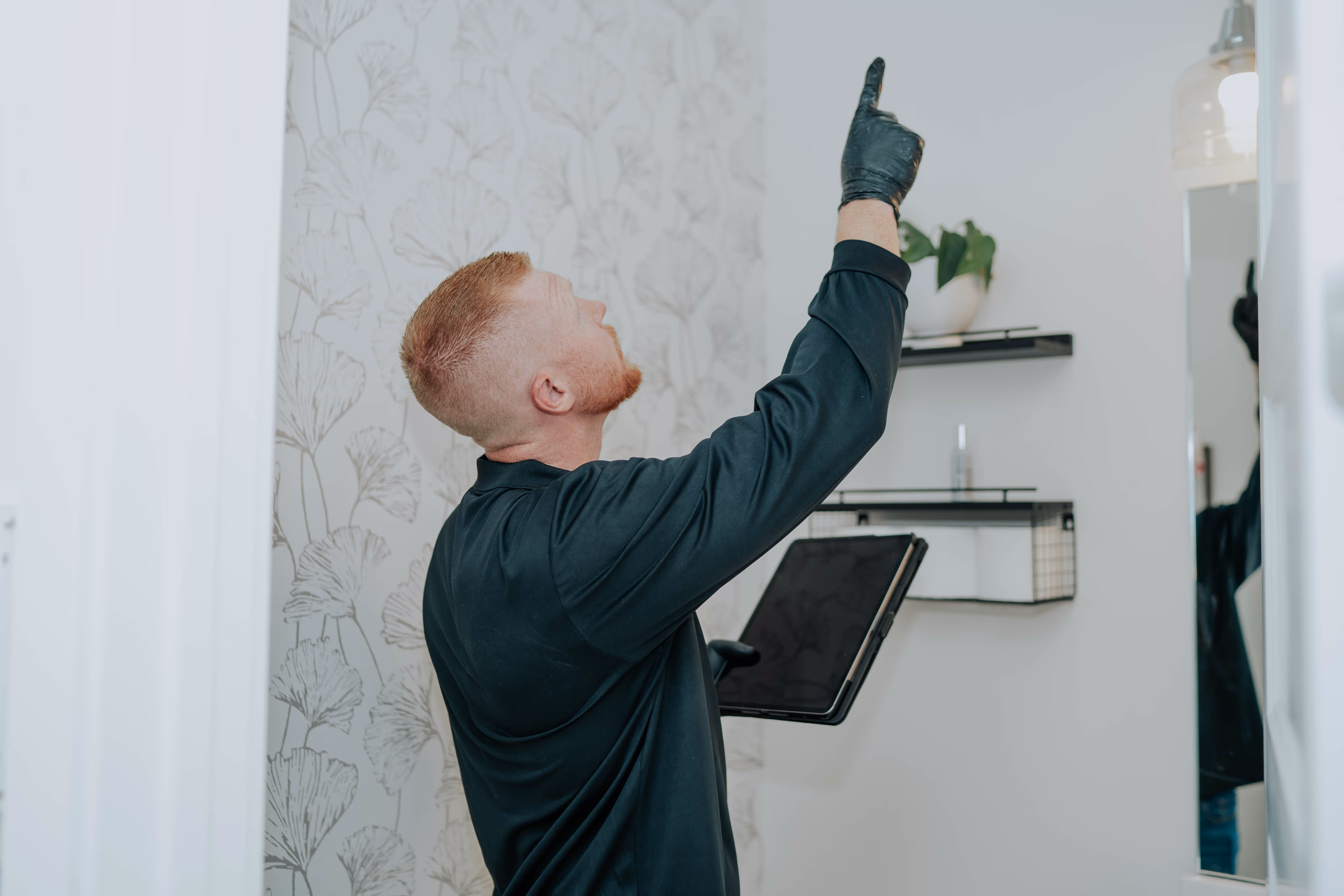 Technician inspecting a property for mold prior to remediation